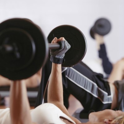 Woman weightlifting in exercise class