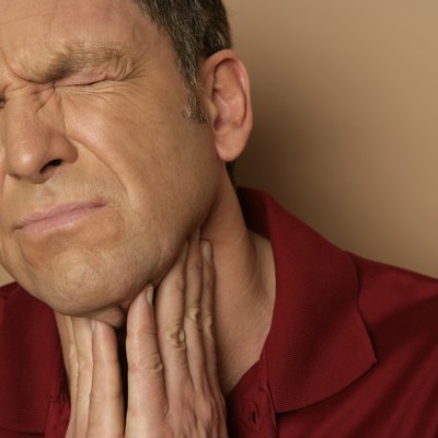 Mature man with sore throat