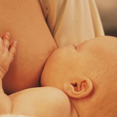 Baby nursing from breast