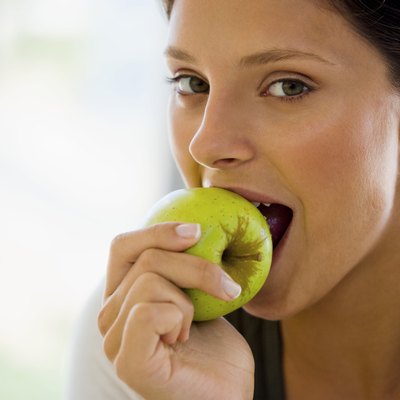Woman eating apple