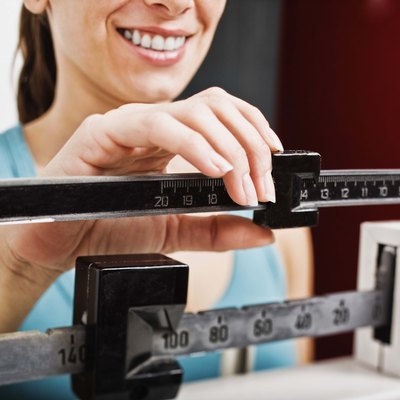 Woman on a scale checking weight