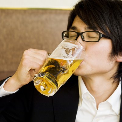 Young man drinking beer