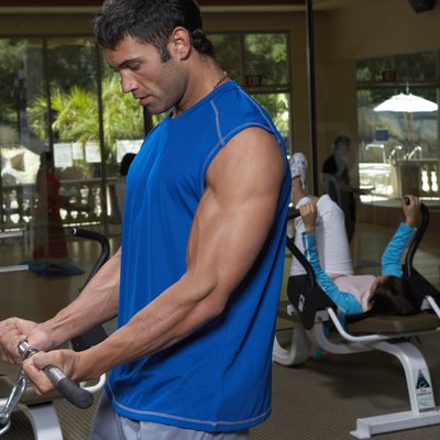 Man doing exercise in gym, close-up