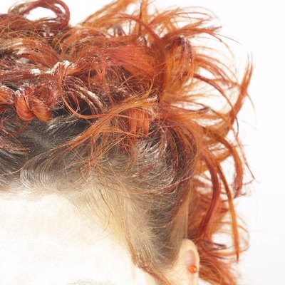 Cropped head shot of girl with curly red hair