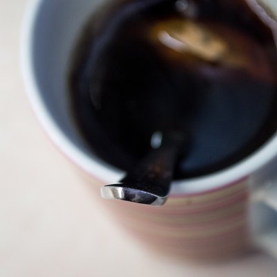 Metal Spoon in Cup of Brewed Tea