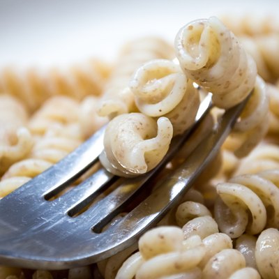 Cooked Plain Brown Wholewheat Fusilli Pasta on a Fork