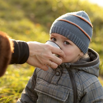 Toddler drinks tea