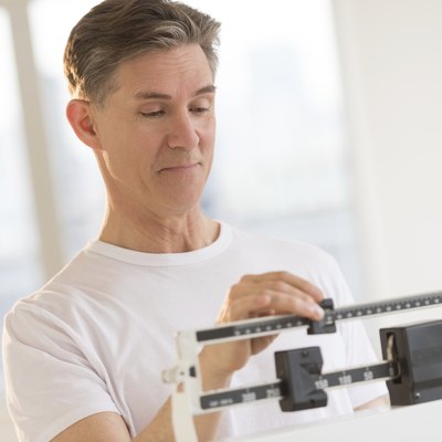 Man Weighing Himself On Balance Weight Scale