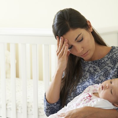 Tired Mother Suffering From Post Natal Depression