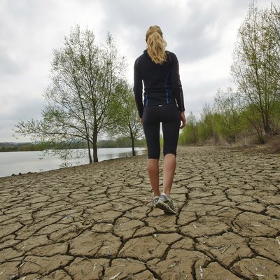Female walking and running by the water