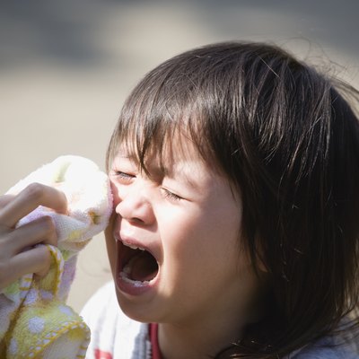 Boy Crying and Mother Wiping Tears