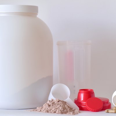 Big jar of protein powder, shaker and pills