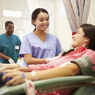 Blood Donors Making Donation In Hospital