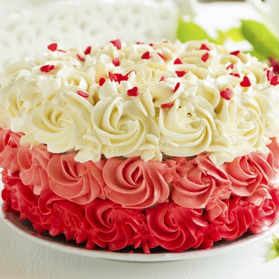 Homemade cake "Red Velvet" decorated with cream.