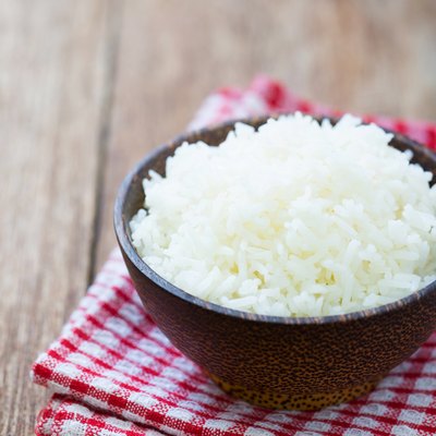 Jasmine rice in a bowl on wood table