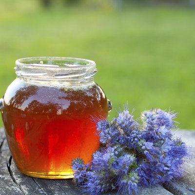 honey on wooden garden table