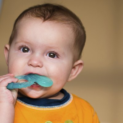 Baby chewing on teething ring