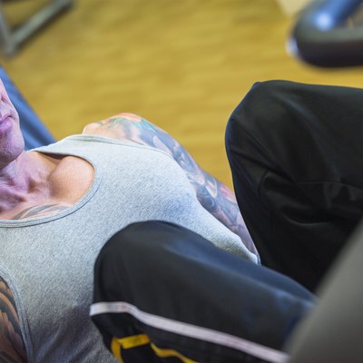 man making leg press - workout routine