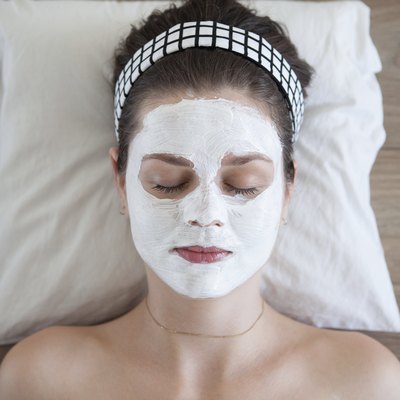 Young woman with facial mask