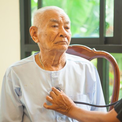 friendly doctor caring senior man indoor