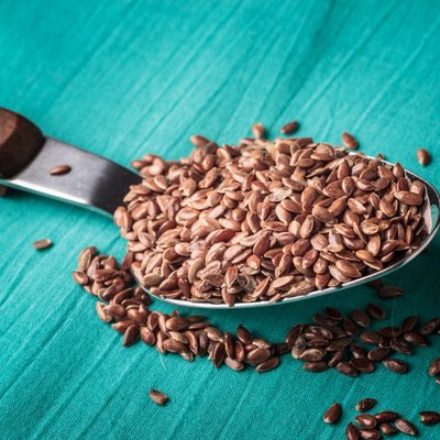 Flax seeds linseed on kitchen spoon