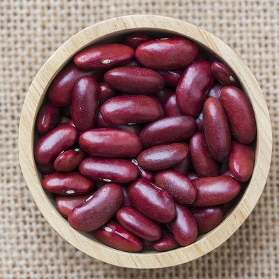 Dried red beans on a wooden table