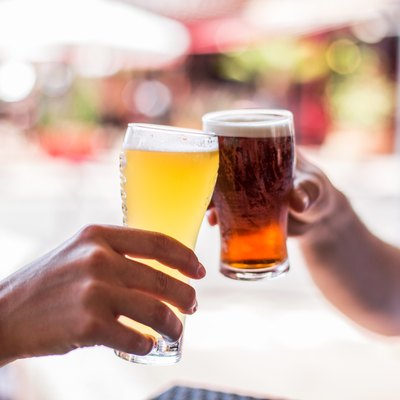 Two friends celebrating with beer. Cheers my friend!