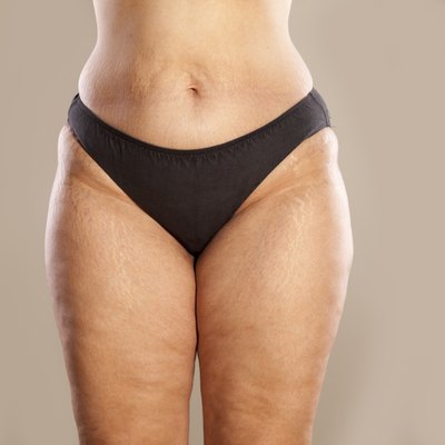 Hips of a very thick woman in black panties