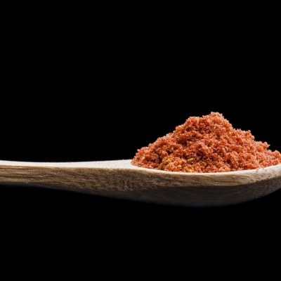 Isolated spices on a wooden spoon