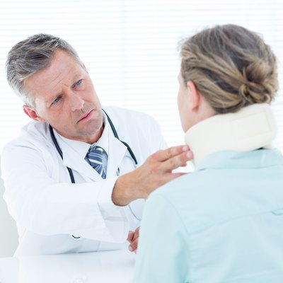 Doctor checking neck brace of his patient