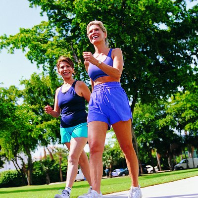 Two women power walking