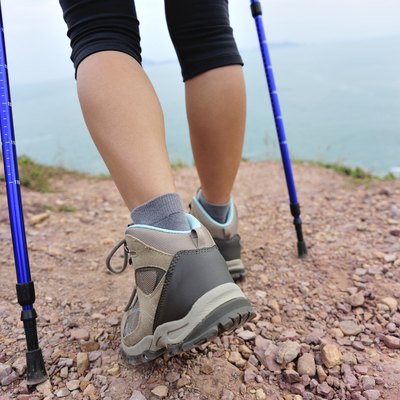 hiking legs on seaside mountain trail
