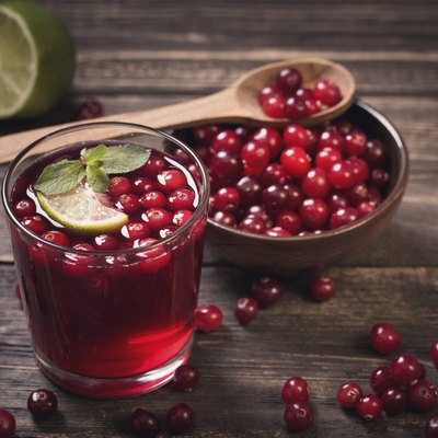 Cranberry juice on old wooden table