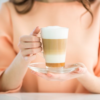 Girl with glass of coffee