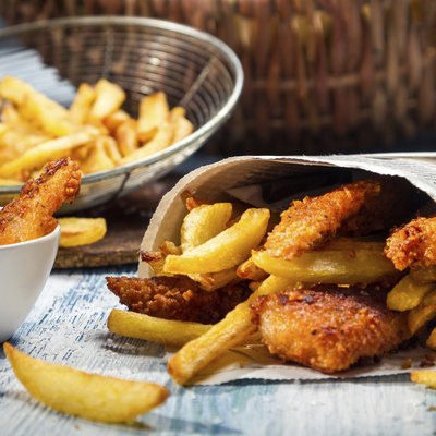 Closeup of Fish & Chips served in paper