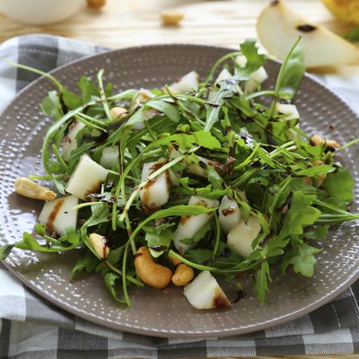 fresh salad with pear, arugula and nuts