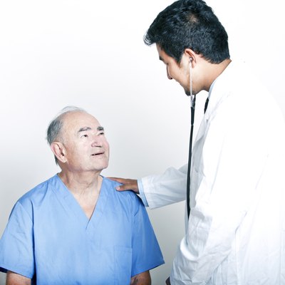 A young Doctor comforting a Senior adult patient