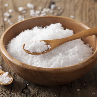 sea salt in wooden bowl and spoon