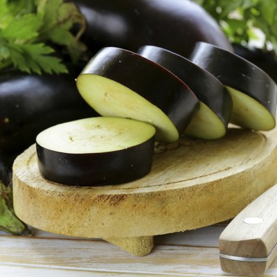 fresh ripe vegetables purple eggplant on a wooden table