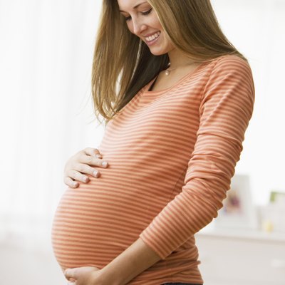 Beautiful young pregnant woman smiling