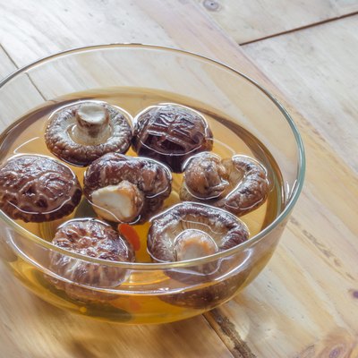 Dried shiitake mushroom in transparent bowl with water