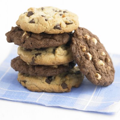 Cookies piled up on a checkered napkin, studio shot