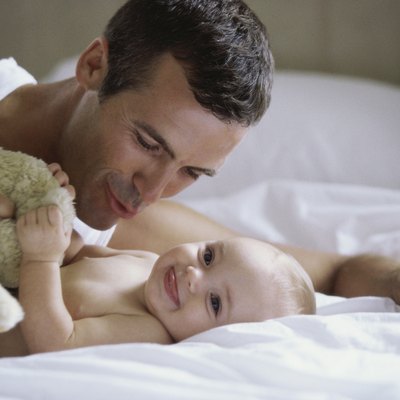 Close-up of a father playing with his baby boy