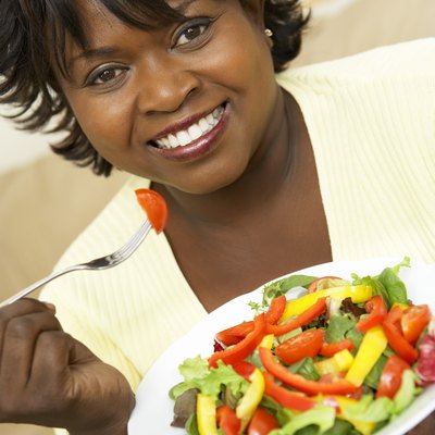 Woman eating salad