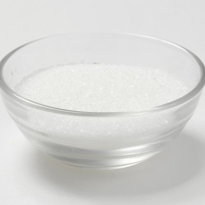 Granulated sugar in a glass bowl, studio shot