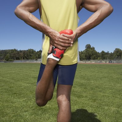 Track athlete stretching before workout