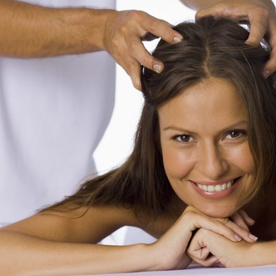 Woman having a scalp massage