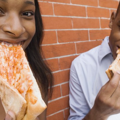 Couple eating pizza