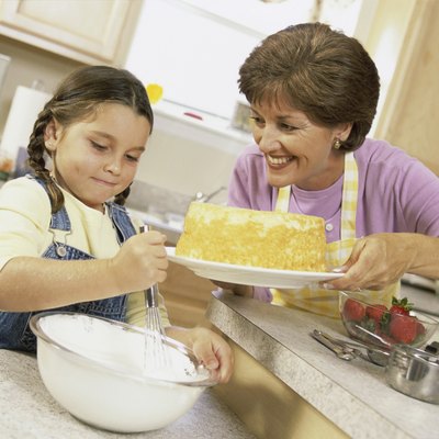 Mother and daughter baking a cake together