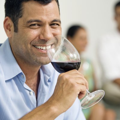 Portrait of a mature man drinking red wine